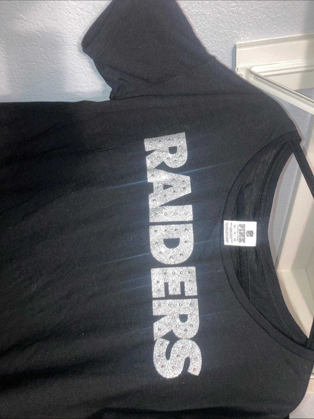PINK Victoria's Secret NFL EDITIONBlack Tee with Silver Glitter RAIDERS Graphic